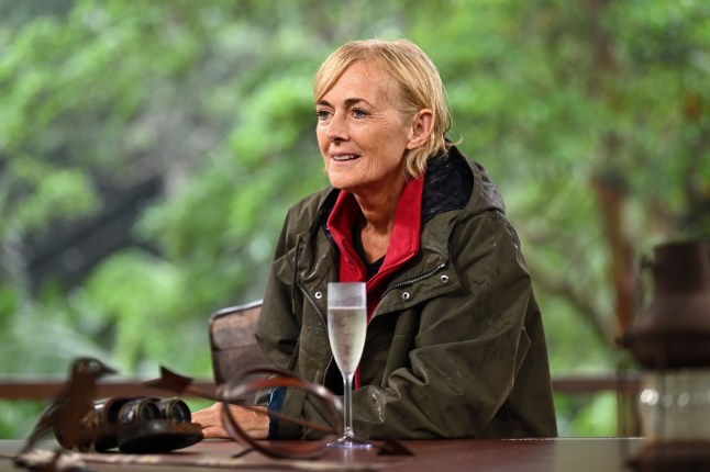Jane Moore in jacket and red scarf on I'm A Celebrity