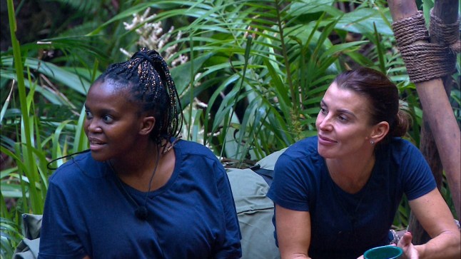 Oti Mabuse and Coleen Rooney in the I'm A Celeb jungle looking over to the side