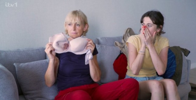 Jane Moore holds up bloody bra as she sits beside daughter who is gasping with hands over her face