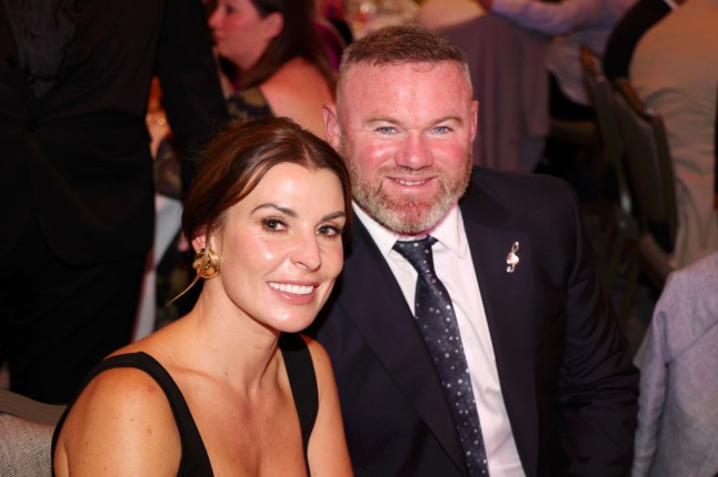 Wayne Rooney and Coleen Rooney smiling together