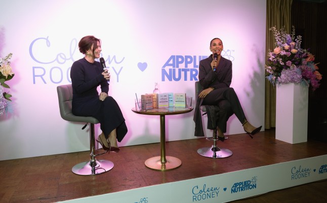 LONDON, ENGLAND - JANUARY 16: Coleen Rooney (L) is interviewed by Rochelle Humes (R) during the launch of Coleen Rooney x Applied Nutrition Wellness Range at White City House on January 16, 2025 in London, England. (Photo by Jo Hale/Getty Images)