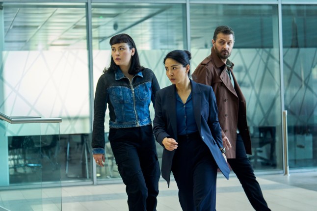 Jemma Moore as Jess Jing Lusi as as DC Hana Li and Richard Armitage as Dr Matthew Nolan walking through an airport in Red Eye