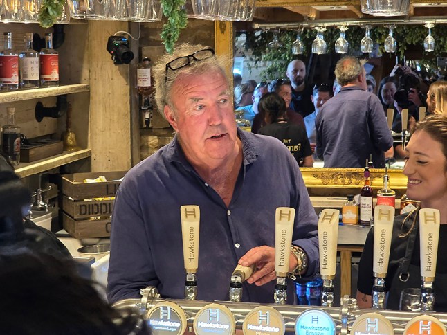 Handout photo issued by Neil Robinson of the opening of Jeremy Clarkson's new pub, The Farmer's Dog, in Asthall, near Burford in Oxfordshire. Issue date: Friday August 23, 2024. PA Photo. The former Top Gear presenter is opening amid fears the venture may bring more traffic problems following the success of his Diddly Squat farm shop, with residents expressing concerns about traffic problems because the pub is located next to the busy A40 road. See PA story SHOWBIZ Clarkson. Photo credit should read: Neil Robinson/PA Wire NOTE TO EDITORS: This handout photo may only be used for editorial reporting purposes for the contemporaneous illustration of events, things or the people in the image or facts mentioned in the caption. Reuse of the picture may require further permission from the copyright holder.