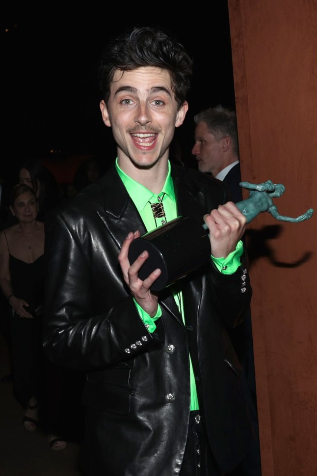 Timothee Chalamet holds SAG award at after party