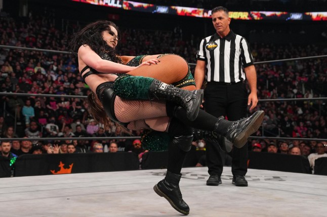 Saraya - AKA Paige in WWE - attacks Britt Baker during their match at AEW Full Gear