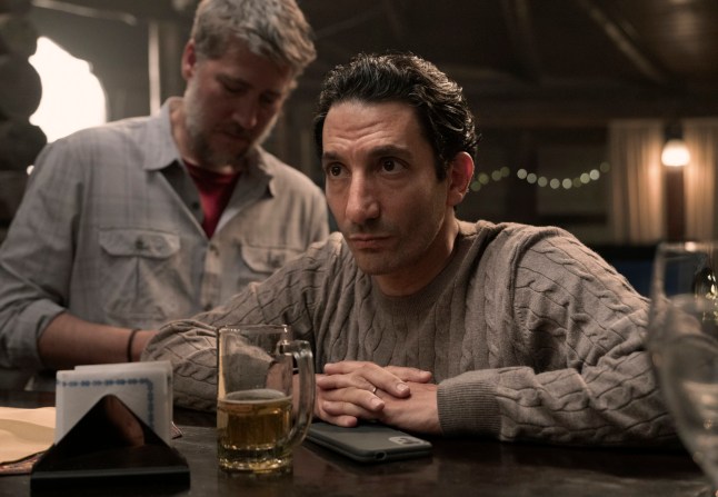 Alberto Ammann as Leo and Juan Minujin as Marcos drinking beer in a bar in Netlfix thriller Caught