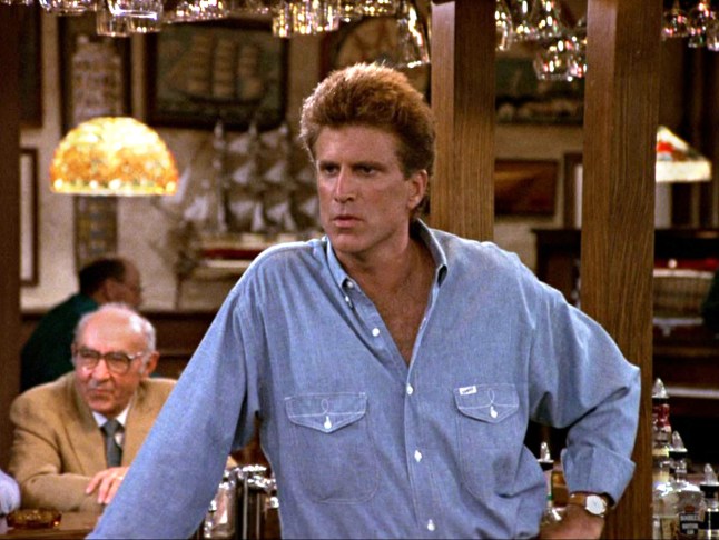 Ted Danson as Sam Malone wearing a blue short in the TV show Cheers in 1989.