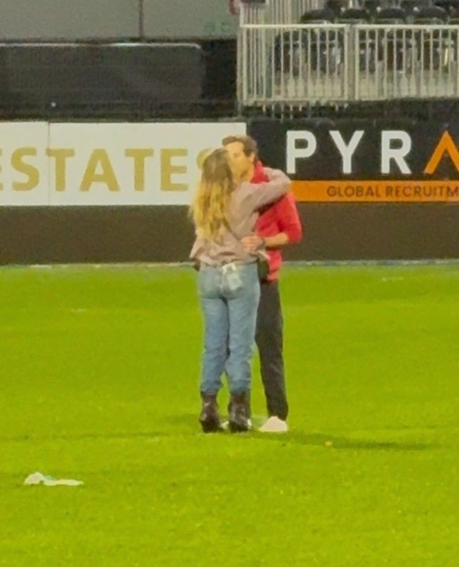 BGUK_3218965 - Wrexham, UNITED KINGDOM - 'Deadpool' star Ryan Reynolds and his wife Blake Lively share a loving and affectionate moment after Wrexham beat Charlton 2-0 to get promoted to the Championship Pictured: Ryan Reynolds - Blake Lively BACKGRID UK 26 APRIL 2025 BYLINE MUST READ: CJ.PICCS / BACKGRID UK: +44 208 344 2007 / uksales@backgrid.com USA: +1 310 798 9111 / usasales@backgrid.com *Pictures Containing Children Please Pixelate Face Prior To Publication*