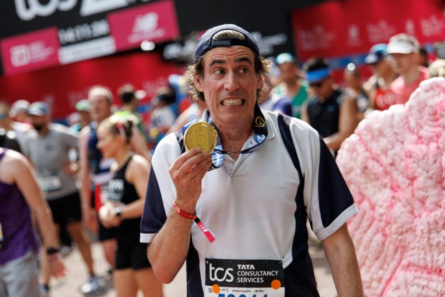 epa12058469 British actor Stephen Mangan poses with his medal after crossing the finish line of London Marathon in London, Britain, 27 April 2025. Taking place since 1981, the London Marathon is one of the most popular marathons in the world, with a record-breaking total of more than 56,000 people are expected to take part in the 2025 race. EPA/TOLGA AKMEN