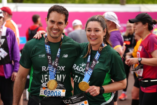 Jeremy Parisi and Kelly Brook after crossing the finish line during the TCS London Marathon. Picture date: Sunday April 27, 2025. PA Photo. See PA story ATHLETICS London Photo credit should read: John Walton/PA Wire. RESTRICTIONS: Use subject to restrictions. Editorial use only, no commercial use without prior consent from rights holder.