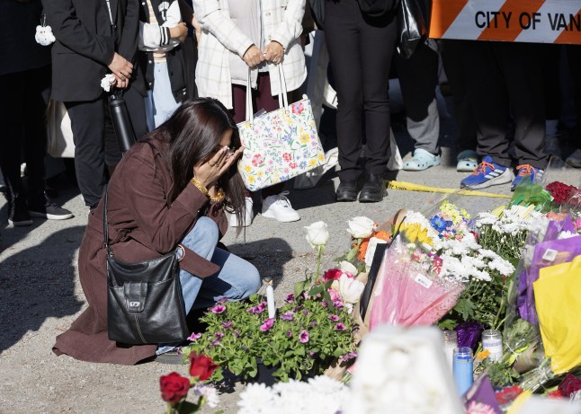 VANCOUVER, BRITISH COLUMBIA - APRIL 27: People attend a vigil near the scene where a car drove into a crowd of people during the Lapu Lapu Festival on April 27, 2025 in Vancouver, Canada. Police said a 30-year-old man drove his car into a crowd at a Filipino street festival, killing at least eleven people and injuring multiple others. (Photo by Andrew Chin/Getty Images)
