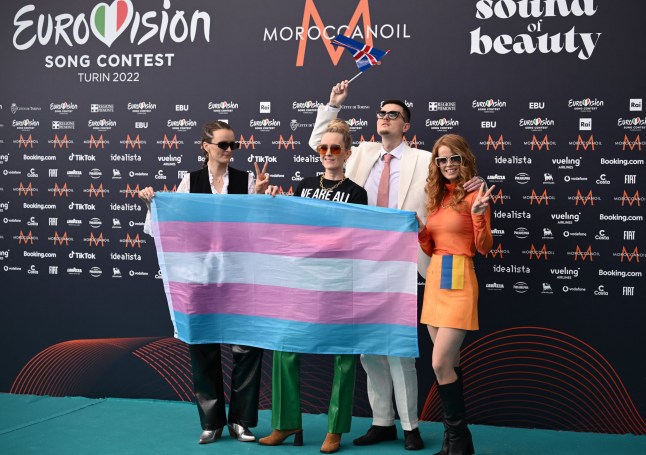 Members of Iceland's band "Systur", Sigga, Beta, Elin and Eythor, holding the Transgender flag (L) and Ukraine's flag (R) at Eurovision