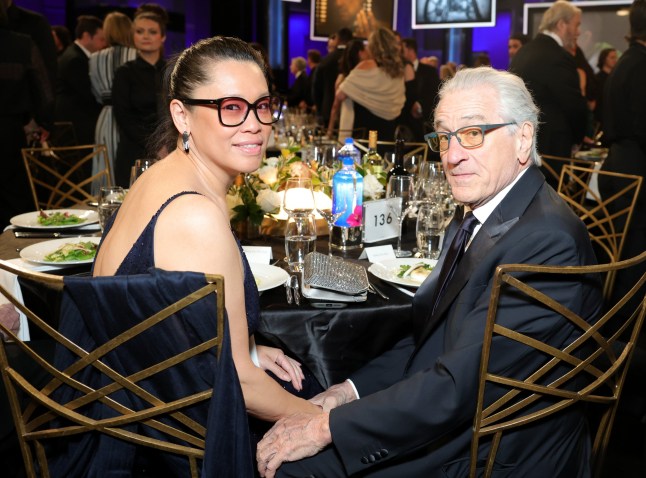 HOLLYWOOD, CALIFORNIA - APRIL 26: (L-R) Tiffany Chen and Robert De Niro attend FIJI Water At The 50th AFI Life Achievement Award Tribute Gala To Francis Ford Coppola at Dolby Theatre on April 26, 2025 in Hollywood, California. (Photo by Stefanie Keenan/Getty Images for FIJI Water)