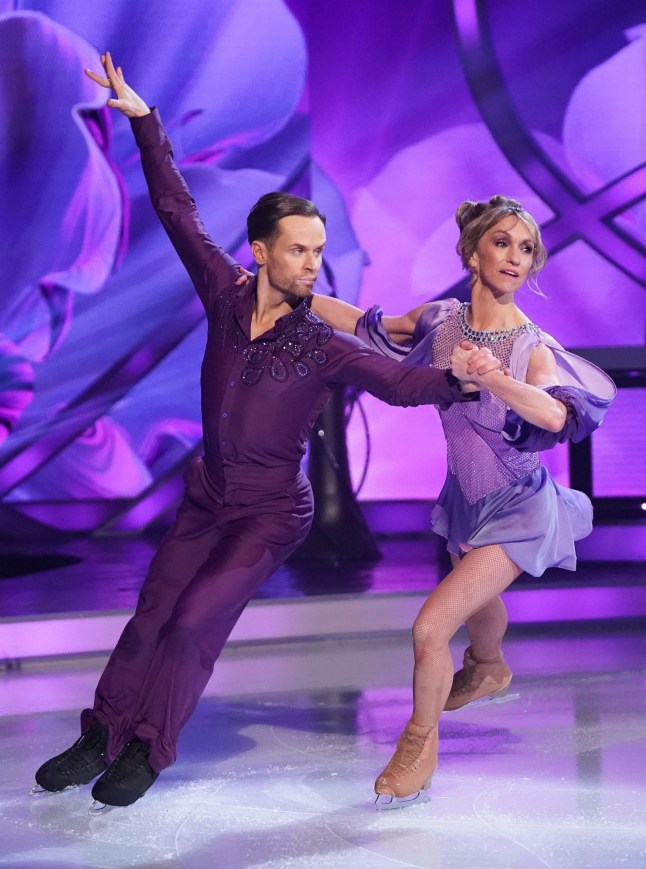 Michaela Strachan and Mark Hanretty in purple matching outfits skating on ice