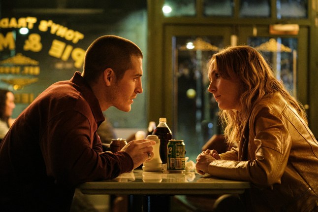 Rose-Ayling Ellis as Alsion in Code of Silence sat on a table meeting with a man