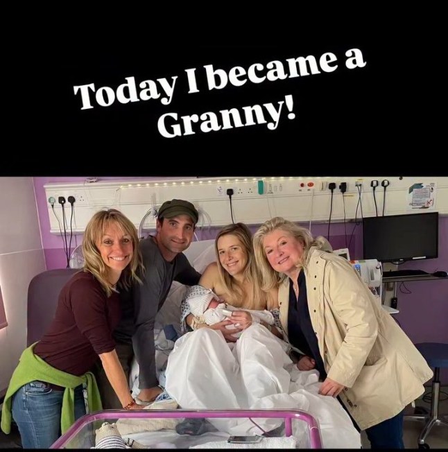 Michaela Strachan posing with her stepson, daughter-in-law and the mother of her stepson Jacky around the hospital bed with her newborn grandchild