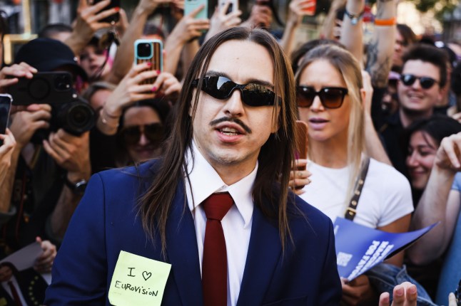 Mandatory Credit: Photo by Alessandro Bremec/NurPhoto/REX/Shutterstock (15280260a) Tommy Cash (Tomas Tammemets) meets fans and distributes coffee to present his song ''Espresso Macchiato'' for the Eurovision Song Contest 2025 at the newsstand in Piazza Morbegno in Milan, Italy, on April 30, 2025 . Tommy Cash Meets Fans And Distributes Coffee To Present His Song Espresso Macchiato For The Eurovision Song Contest 2025 At The Newsstand In Milan, Italy - 30 Apr 2025