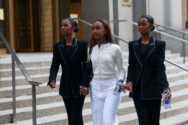 Daughters of Sean "Diddy" Combs walk outside the court on the first day in the trial of Combs on sex trafficking and racketeering conspiracy charges at U.S. court in Manhattan, in New York City, U.S., May 12, 2025. REUTERS/Jeenah Moon