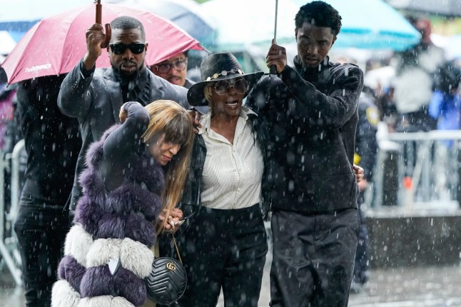 King Combs (R), son of Sean Combs, holds an umbrella for Janice Combs, mother of Sean Combs, as they arrive at federal court for Sean "Diddy" Combs' sex trafficking trial in New York City on May 14, 2025. Sean "Diddy" Combs used violence and threats of reputational ruin to control women he abused for years, New York jurors heard May 12 during opening statements of the federal sex trafficking trial that was followed by the case's intitial graphic testimonies. The panel of 12 jurors and six alternates responsible for determining Combs's fate heard of the famed artist's explosive outbursts and an attempt to preserve his own reputation and power of celebrity through bribery. (Photo by TIMOTHY A. CLARY / AFP) (Photo by TIMOTHY A. CLARY/AFP via Getty Images)