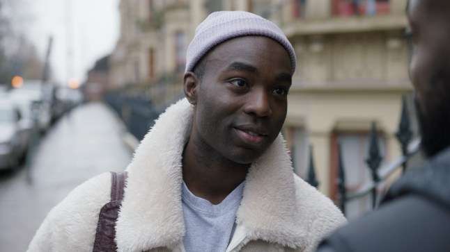 Paapa Essiedu as Kwame talking to a character in a London street in I May Destroy You.